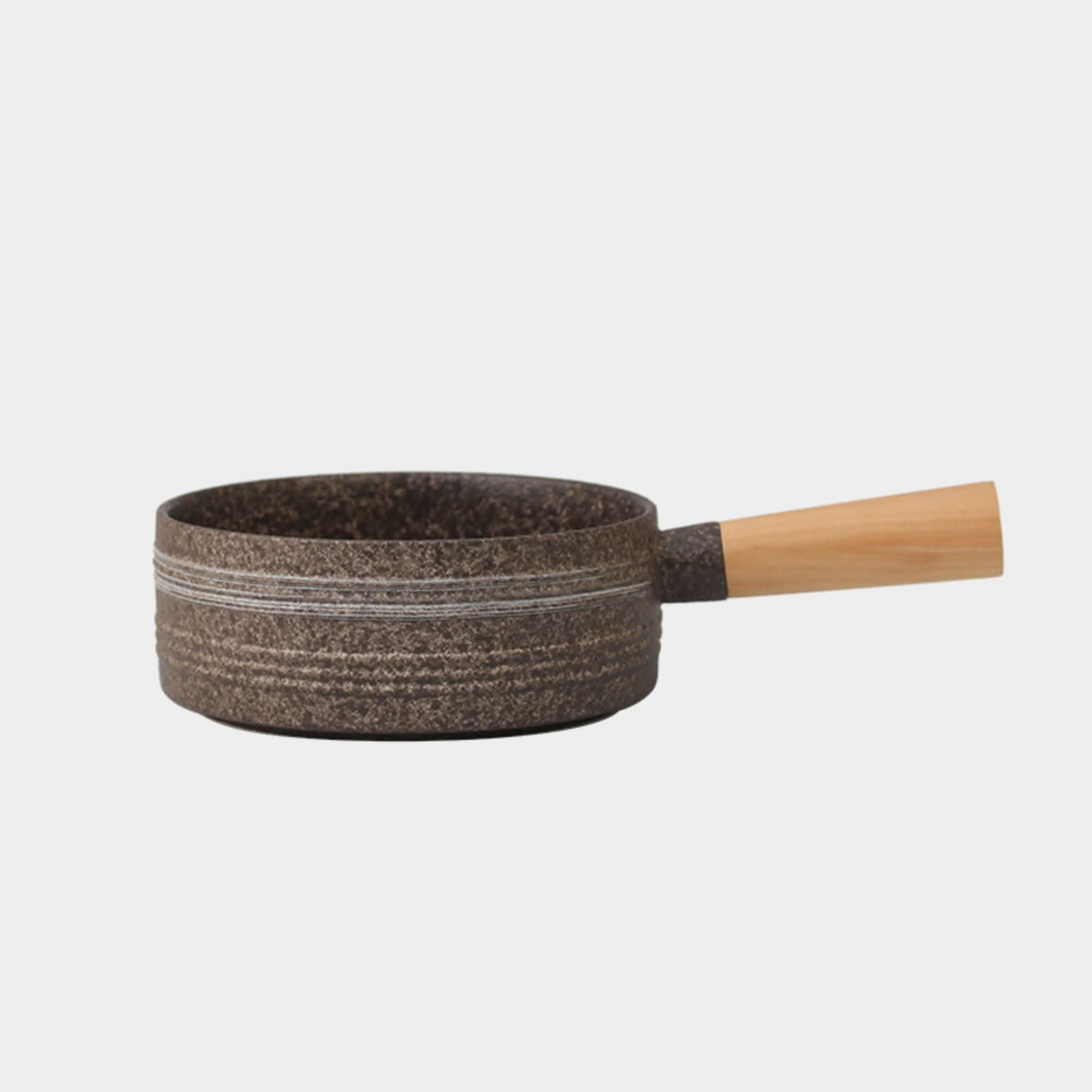 Rustic stoneware baking plate with Japanese art and wood handle